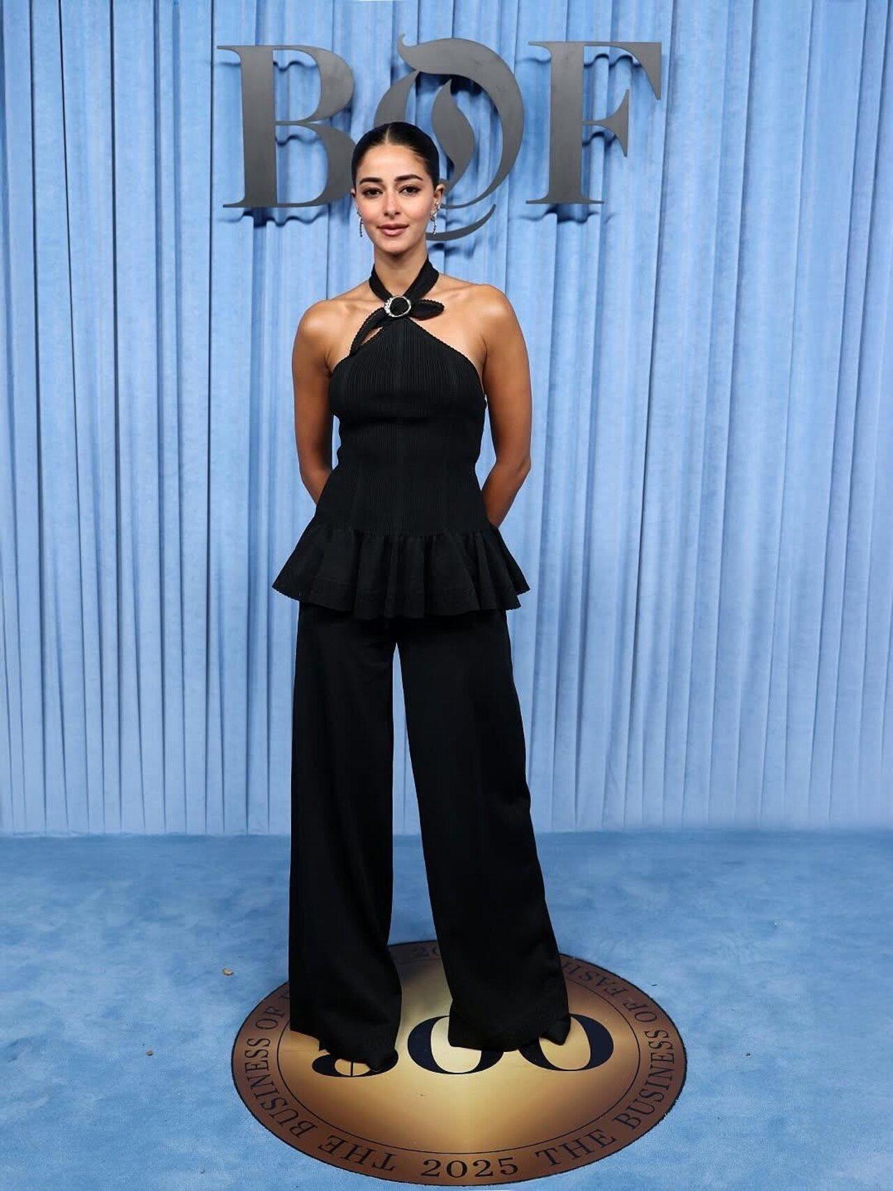Bollywood actress Ananya Panday made a striking appearance at the BoF 500 gala in Paris. For the event, she opted for a black halter neck peplum top and matching flared pants.